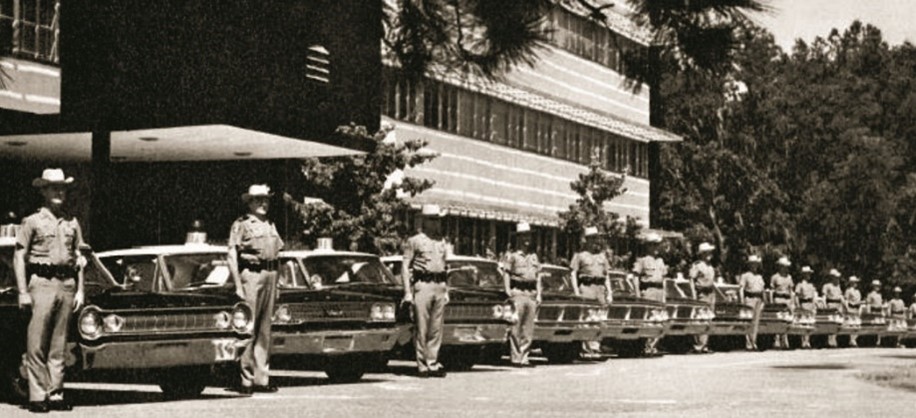 Troopers are inspected in front of the Neil Kirkman Building, 1964