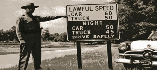 Trooper Joyce with the first speed sign, 1953