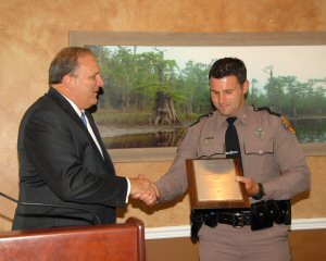 Trooper Earrey receives plaque from FPC Representative