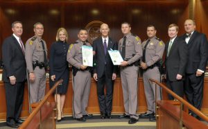 Sgt. Feola, Tpr. Ivey with Governor Scott, Cabinet and FHP Exec. Staff