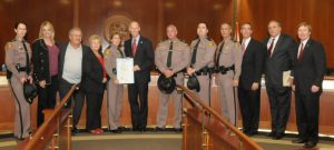Sgt. Godino with her family, Gov. Rick Scott, Cabinet Members, Florida Petroleum Council Rep. and FHP's Executive Staff.