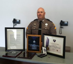 Trooper Litzell receives Purple Heart award