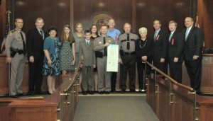 Colonel Brierton, Governor Scott and the Cabinet with Corporal Stevens and his family.