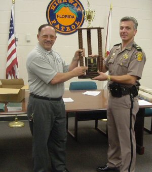 Major Grady Carrick accepts the Troop Challenge trophy