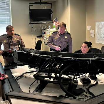 Colonel and Lt. Colonel meeting with staff at Regional Communication Center