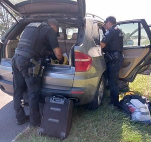 Troopers searching suspect car